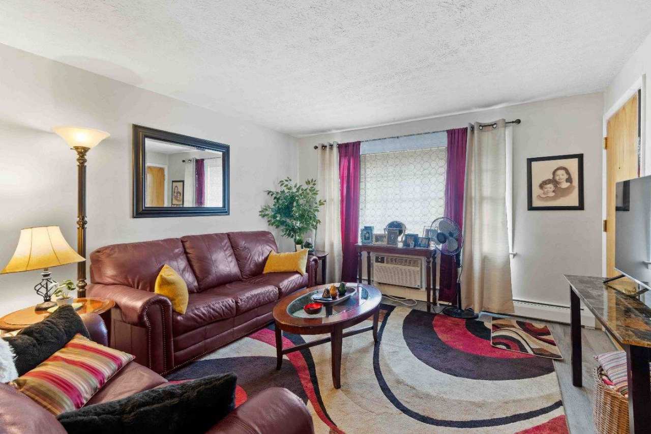 Living room with window and leather sofas