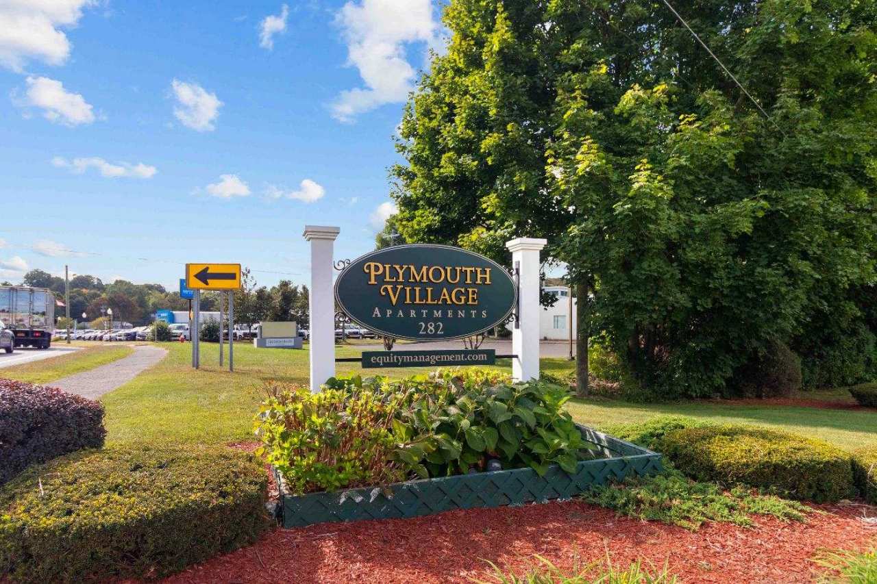 Plymouth Village Apartments entrance sign at 282 Main Street
