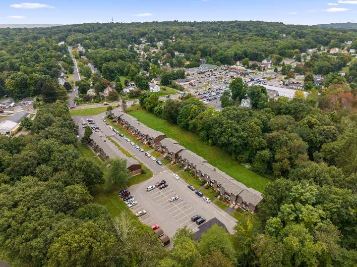 Aerial view of the buildings with hills beyond