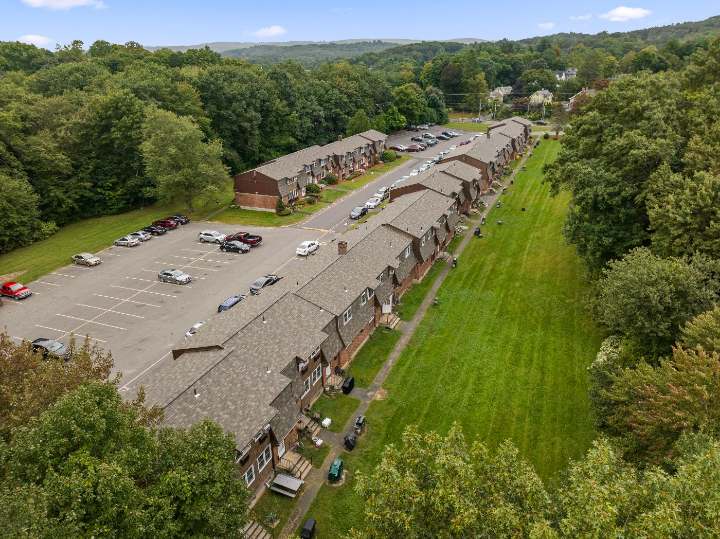 Aerial view along the buildings and rear lawn