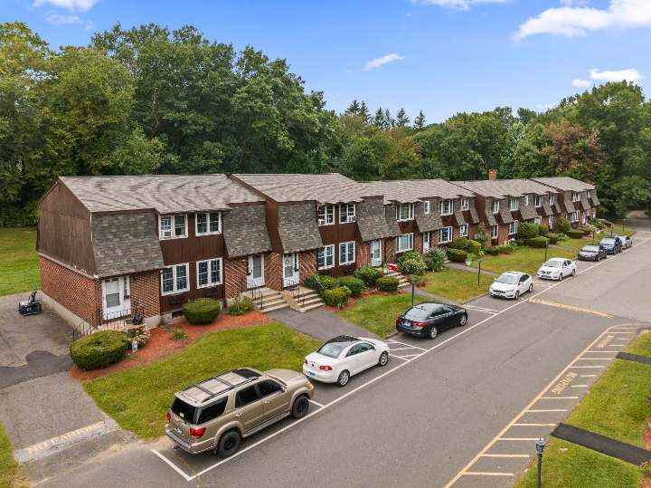 Row of residences with parking along the drive