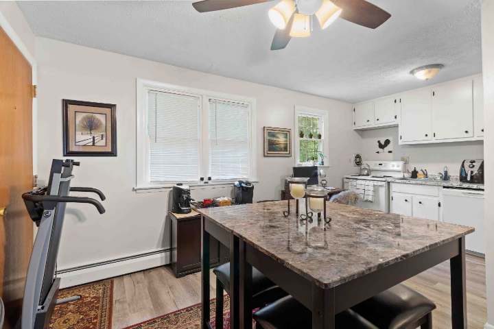 Dining area and kitchen with windows